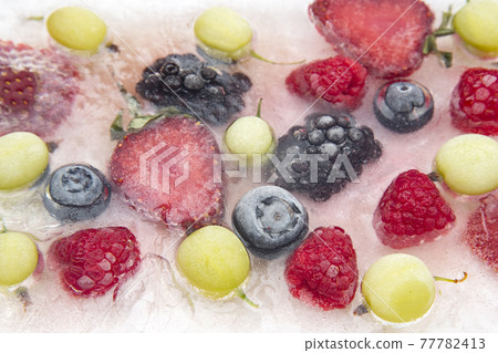 different juicy berries frozen in ice. useful vitamin healthy food fruit different juicy berries frozen in ice. useful vitamin healthy food fruit 77782413