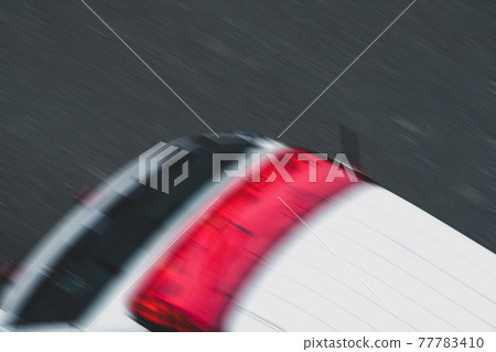 A bird's-eye view of the ambulance and the asphalt road with blurring Coolness and contrast 77783410