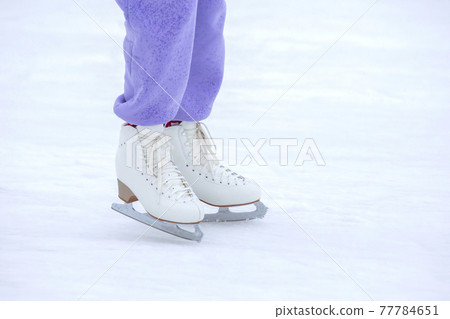 ice skating woman legs on ice rink. hobbies and winter sports ice skating woman legs on ice rink. hobbies and winter sports 77784651