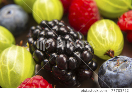 lots of fresh different berries. useful vitamin healthy food fruit. healthy vegetable breakfast 77785732