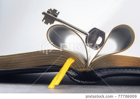Key and open textbook of life. The book is the key and opening to knowledge and wisdom. Key and open textbook of life. The book is the key and opening to knowledge and wisdom. 77786009