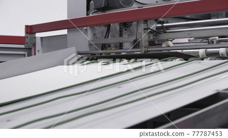 Enterprise for the production of cardboard containers .Cardboard manufacturing layering rollers roll industrial industry printing packaging material closeup. Paper corrugated box factory. Enterprise for the production of cardboard containers .Cardboard manufacturing layering rollers roll industrial industry printing packaging material closeup. Paper corrugated box factory. 77787453