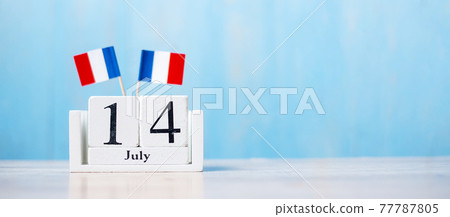 Wooden calendar of July 14th with miniature France flags. French National Day, Bastille Day and happy celebration concepts Wooden calendar of July 14th with miniature France flags. French National Day, Bastille Day and happy celebration concepts 77787805