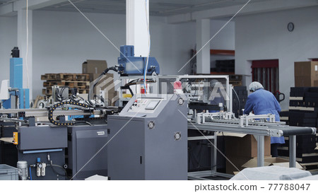 Modern automatic conveyor line for the production of package. Modern factory of production cardboard box. Manufacture of cardboard boxes from paper. Enterprise for production package 77788047