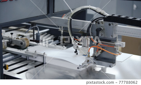 Modern automatic conveyor line for the production of package. Modern factory of production cardboard box. Manufacture of cardboard boxes from paper. Enterprise for production package 77788062