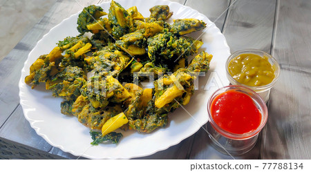 Spinach & potato Pakoras, An extremely delicious and mouth watering snack of Pakistani & Indian Peoples Spinach & potato Pakoras, An extremely delicious and mouth watering snack of Pakistani & Indian Peoples 77788134