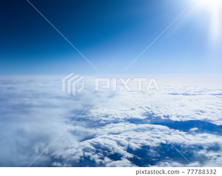 Sea of clouds seen from the window of the passenger seat of a commercial aircraft (Japan) 77788332