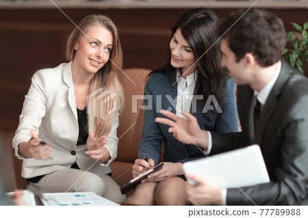 business woman talking to her business team 77789988