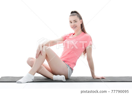 fitness, sport, people and healthy lifestyle concept - woman making yoga meditation in lotus pose on mat 77790095