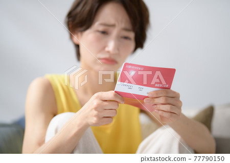 Middle women passbook worried money 77790150
