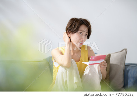 Middle women passbook worried money Middle women passbook worried money 77790152