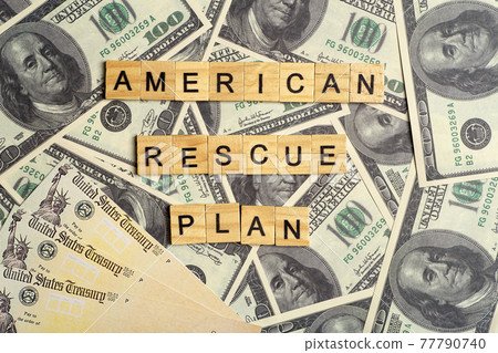 USA dollars background. American rescue plan, USA relief program, stimulus check and Act of 2021 concept. Money, business, profit and livelihood idea USA dollars background. American rescue plan, USA relief program, stimulus check and Act of 2021 concept. Money, business, profit and livelihood idea 77790740