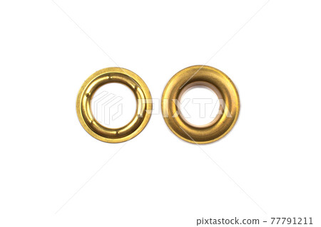 Catalogue photo of brass multicoloured metal eyelets or rivets - curtains rings for fastening fabric to the cornice, isolated on white background with copyspace for text. Selective focus 77791211
