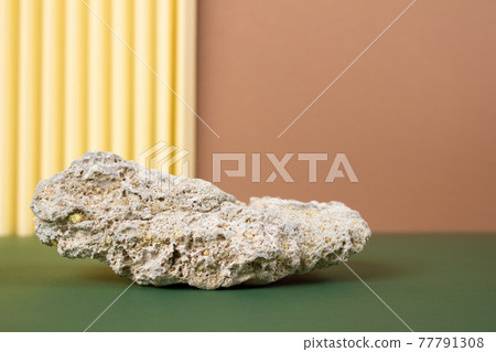 Modern still life composition with natural stone against background in neutral colours with copy space. Modern abstract composition Modern still life composition with natural stone against background in neutral colours with copy space. Modern abstract composition 77791308
