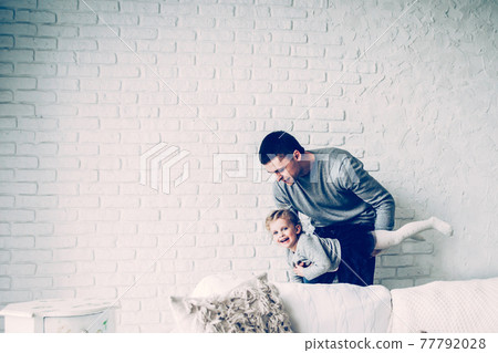 loving father plays with his baby daughter loving father plays with his baby daughter 77792028