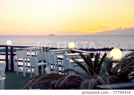 Empty bar at sunset on Tenerife island, Costa Adeje with sunset ocean view Empty bar at sunset on Tenerife island, Costa Adeje with sunset ocean view 77794430