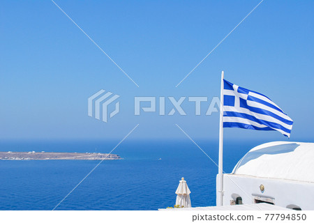 Greek flag and Aegean Sea from Santorini 77794850