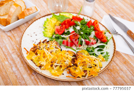 Veal Orloff served with baked potato and vegetable salad Veal Orloff served with baked potato and vegetable salad 77795037