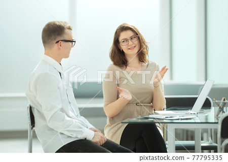 side view. business colleagues discuss ideas for a new commercial project 77795335