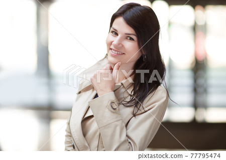 young business woman on the background of the office young business woman on the background of the office 77795474