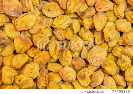 Background texture of dried apricots. Top view. Background texture of dried apricots. Top view. 77795829