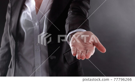 close up. business woman with open palm .isolated on black background close up. business woman with open palm .isolated on black background 77796266