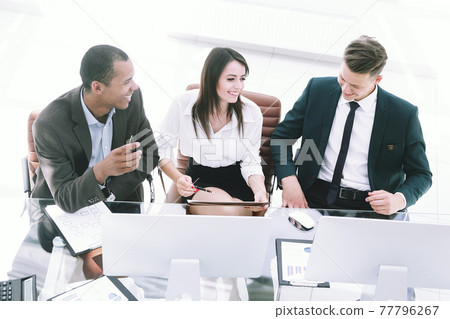 professional business team sitting at Desk in the office professional business team sitting at Desk in the office 77796267