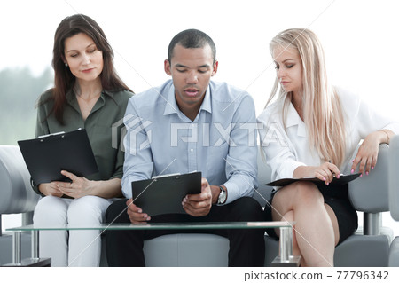 business team with laptop during a work break 77796342