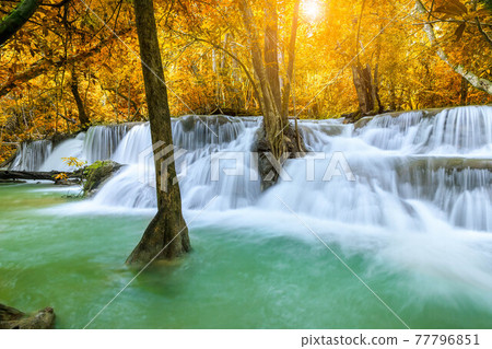 Colorful majestic waterfall in national park forest during autumn - Image Colorful majestic waterfall in national park forest during autumn - Image 77796851