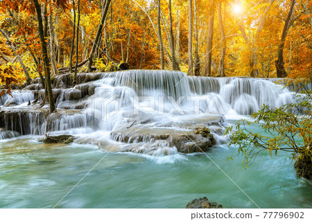 Colorful majestic waterfall in national park forest during autumn - Image 77796902