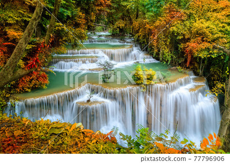 Colorful majestic waterfall in national park forest during autumn - Image 77796906