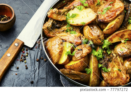 Chicken baked with potatoes in a pan Chicken baked with potatoes in a pan 77797272