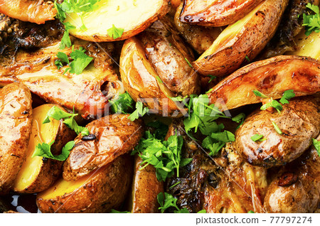 Chicken baked with potatoes in a pan Chicken baked with potatoes in a pan 77797274
