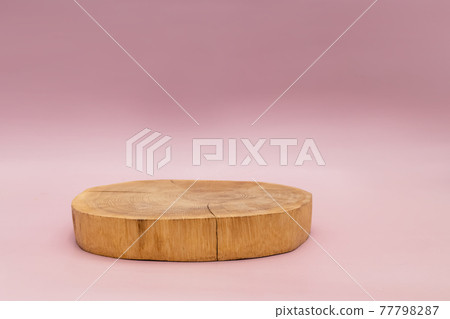 Wood podium on pink background for product presentation 77798287