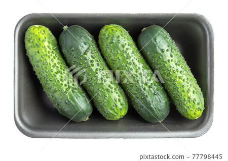 Four cucumbers in the black plastic container isolated on white Four cucumbers in the black plastic container isolated on white 77798445