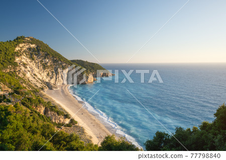 Milos beach near the Agios Nikitas village on Lefkada Ionian island, Greece. Evening sunset golden light 77798840