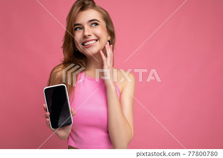 Sexy beautiful joyful young blonde woman wearing pink top poising isolated on pink background with Sexy beautiful joyful young blonde woman wearing pink top poising isolated on pink background with 77800780