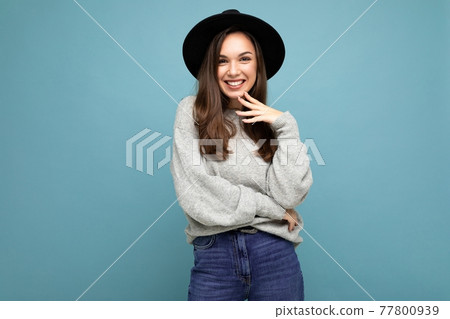 Photo of young positive happy smiling beautiful woman with sincere emotions wearing stylish clothes 77800939