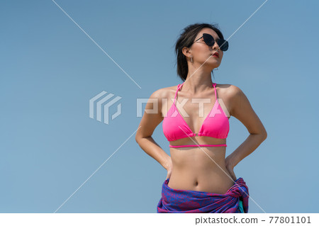 Portrait of thai woman posing outdoors at the sea beach Portrait of thai woman posing outdoors at the sea beach 77801101