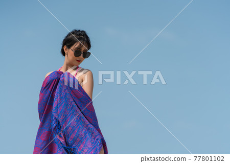 Portrait of thai woman posing outdoors at the sea beach Portrait of thai woman posing outdoors at the sea beach 77801102