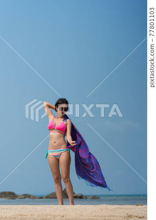 Portrait of thai woman posing outdoors at the sea beach Portrait of thai woman posing outdoors at the sea beach 77801103