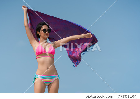 Portrait of thai woman posing outdoors at the sea beach Portrait of thai woman posing outdoors at the sea beach 77801104