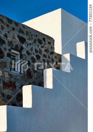 Greek architecture abstract background - whitewashed house with stairs. Milos island, Greece Greek architecture abstract background - whitewashed house with stairs. Milos island, Greece 77801184
