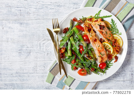 grilled salmon fillets with lemon, bacon,vegetables grilled salmon fillets with lemon, bacon,vegetables 77802278