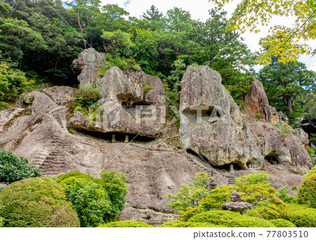 Caves and steps cut into rock at Natadera temple, Japan. 77803510