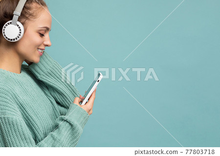 Closeup photo of beautiful joyful smiling young woman wearing stylish casual clothes isolated over 77803718