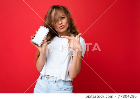 Photo of beautiful happy young woman good looking wearing casual stylish outfit standing isolated on 77804286