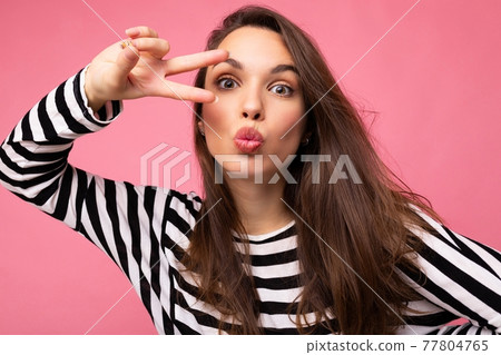 Photo of young european positive winsome sexy beautiful brunette woman with sincere emotions wearing 77804765