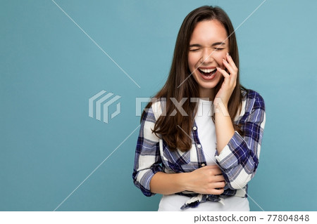 Photo portrait of young beautiful smiling hipster brunette woman in trendy blue and white shirt and Photo portrait of young beautiful smiling hipster brunette woman in trendy blue and white shirt and 77804848
