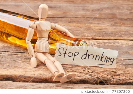 Stop drinking message, wooden dummy. 77807200